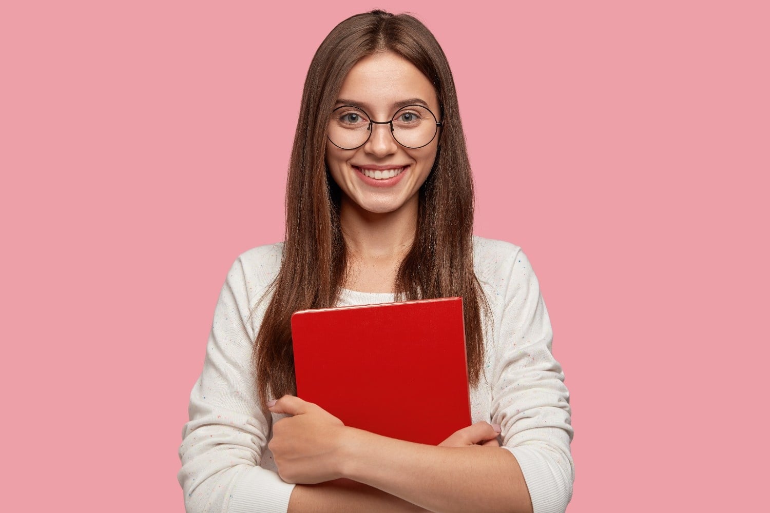 Smiling student learning online, waist-up portrait with pleasant expression